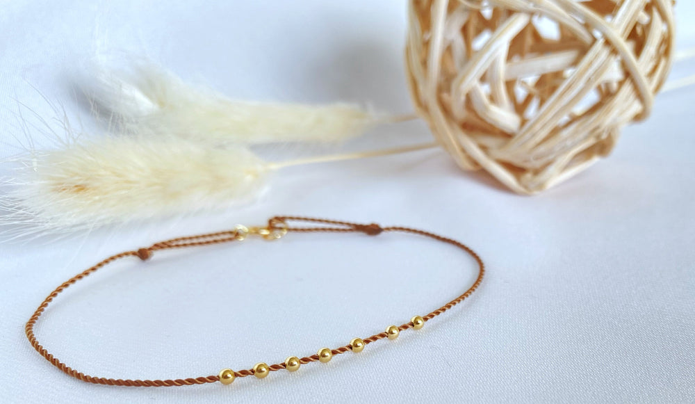 Seven yellow gold beads bracelet